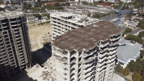 Bird's Eye View of New Residential Blocks Emerging.
A slow, breathtaking drone video showcases the rise of a new housing development, featuring a prominent blue crane.