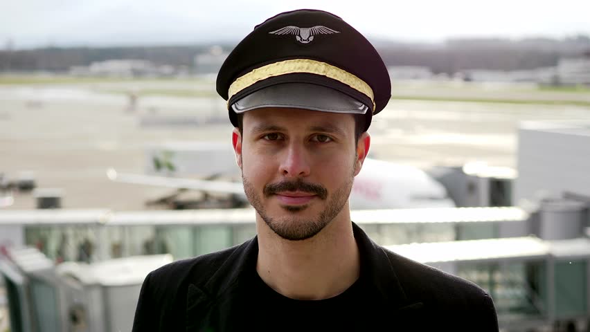 Portrait of Proffesional Male Pilot Captain Working in Aviation Business
