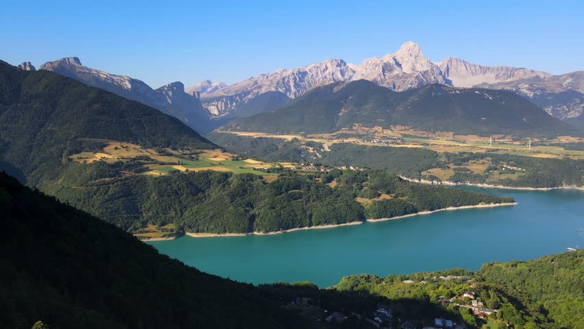 Aerial view of Sautet Lake and the higest point in the Devoluy mountain range, the Obiou peak. Isere, Alps, France
