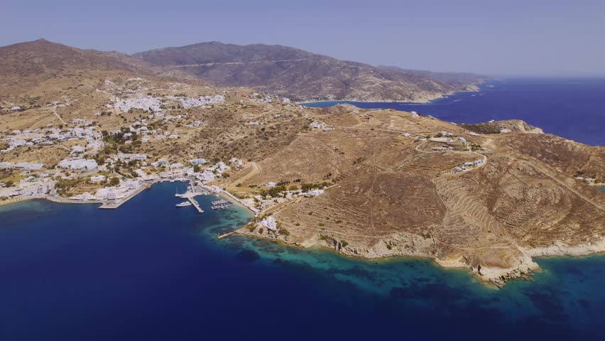 Aerial view of the coastline of Chora, also known as Hora, capital of the island of Ios in Greece. Cinematic 4k. | Shutterstock HD Video #1108526413