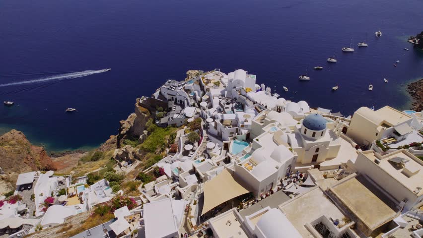 Aerial view of a white village during a beautiful sunset in Santorini, Greece. Cinematic 4k. | Shutterstock HD Video #1108526415