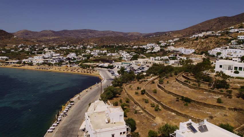 Aerial view of the coastline of Chora, also known as Hora, capital of the island of Ios in Greece. Cinematic 4k. | Shutterstock HD Video #1108526417