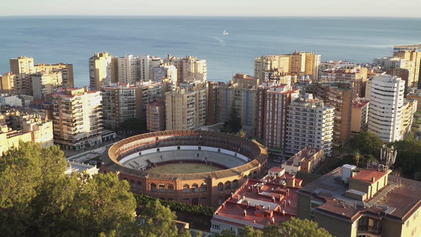 Captivating aerial footage of Malaga, a vibrant coastal city located in the province of Andalusia, Spain