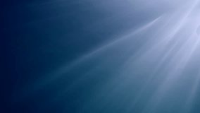 Slanting sunbeams underwater surface luminous in Ocean. Sunshine penetrate below waters through sea surface shiny into blue water. Oblique sun rays underwater. Diagon sunburst in depth, Slow motion
 - Powered by Shutterstock - Get 15% off with code: PIKWIZARD15