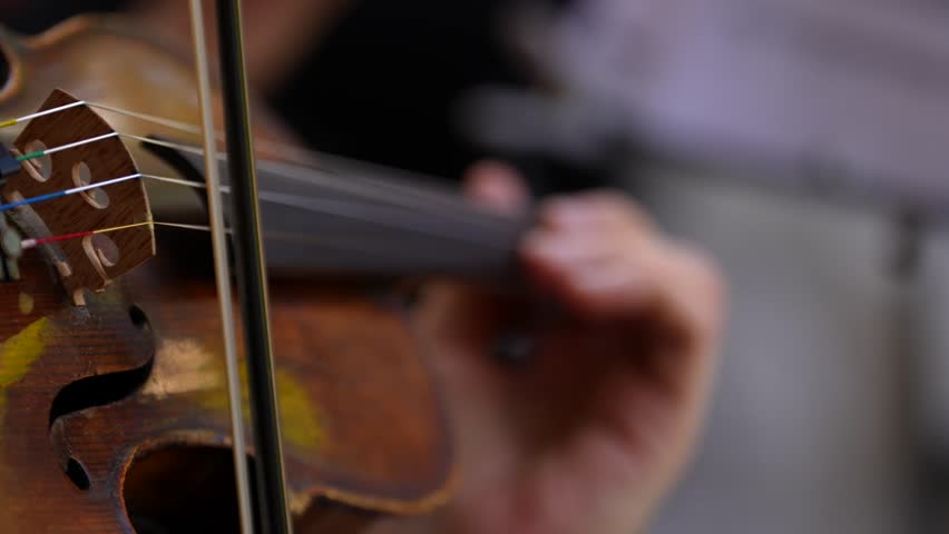 Violinist playing in a concert on a summer terrace. 4k close up video with the detail hand of a violonist singer artist.  Royalty-Free Stock Footage #1108534485