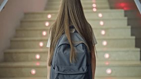 Young beautiful girl student wearing backpack climbing stairs up at school - Powered by Shutterstock - Get 15% off with code: PIKWIZARD15
