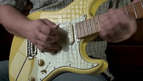 Man playing electric guitar using tremolo. 4k video footage UHD 3840x2160