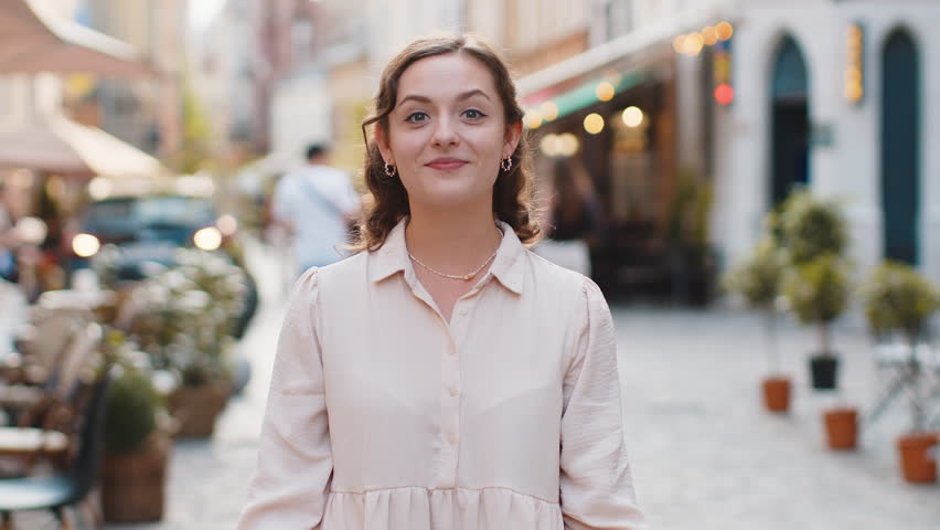 Like. Happy young pretty woman looking approvingly at camera showing thumbs up, like sign positive something good positive feedback. Lovely girl walking in urban city street. Town lifestyles outdoor | Shutterstock HD Video #1108540239