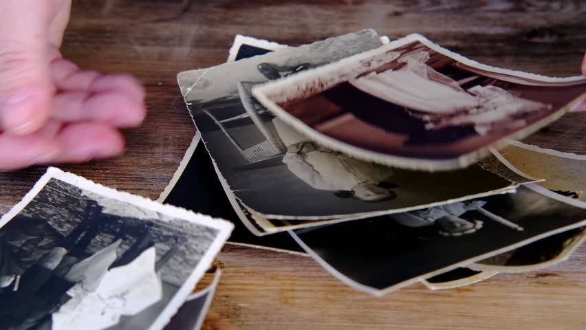 old photos from 1940, envelopes from letters, home archive documents on wooden table, concept of family tree, genealogy, memories, memory of ancestors, nostalgia, childhood remembering Royalty-Free Stock Footage #1108540603