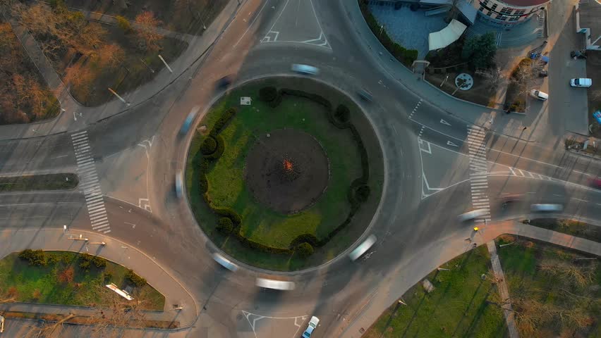 4k aerial view timelapse of roundabout road with circular cars. Royalty-Free Stock Footage #1108540847