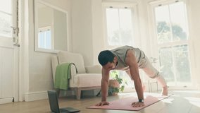 Man, yoga and cobra pose, body and fitness at home for health and healing, laptop for online class and stretching. Wellness, zen with virtual exercise video or lesson, yogi in lounge with pilates