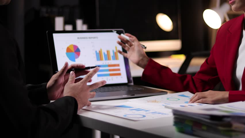 Businessman meeting discuss analysis of financial charts and graphs of business marketing growth statistics. Meeting or analysis of business strategies and financial investment plans. Royalty-Free Stock Footage #1108549567