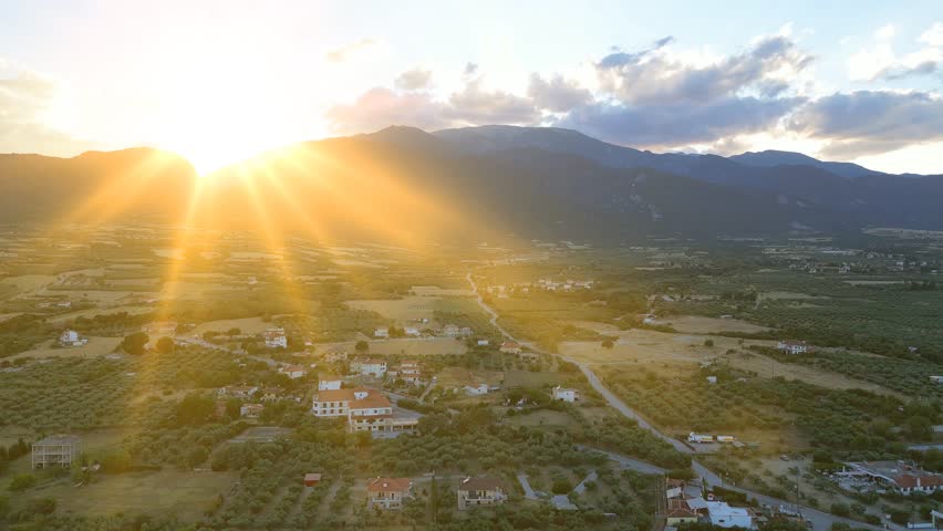 Aerial view of of Mount Olympus in Greece at sunset. Drone shot of the landscape of the ancient mountain of the gods, seasonal nature trip in an idyllic summer. Flying from the Leptokarya