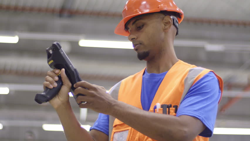 Warehouse employee using handheld barcode reader while doing inventory management. Delivery manager Storehouse scanning goods bar code in industrial storehouse Royalty-Free Stock Footage #1108552851