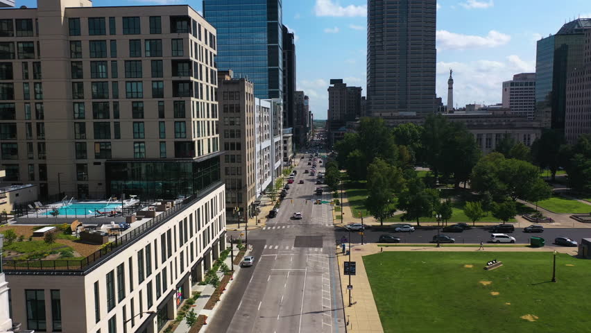 Aerial view flying low over streets, in middle of skyscrapers of downtown Indianapolis, USA