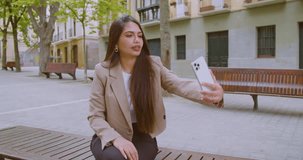 beautiful woman making selfies outside