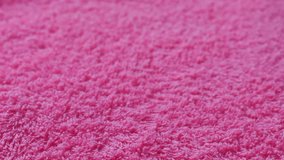 Top view time lapse of pink towel texture as background