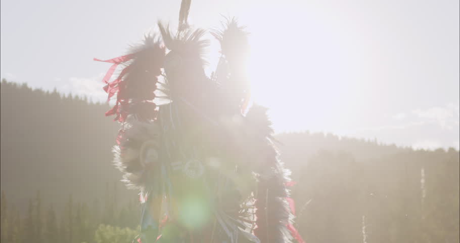 Beautiful Shot of Young Indigenous Boy Fancy Dancing In traditional Regalia at sunset on the prairies of Alberta Canada, Tsu'Tina Nation Royalty-Free Stock Footage #1108563633