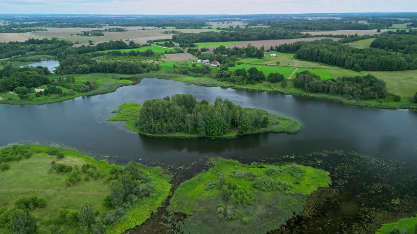 Drone view over a green water landscape with several islands.