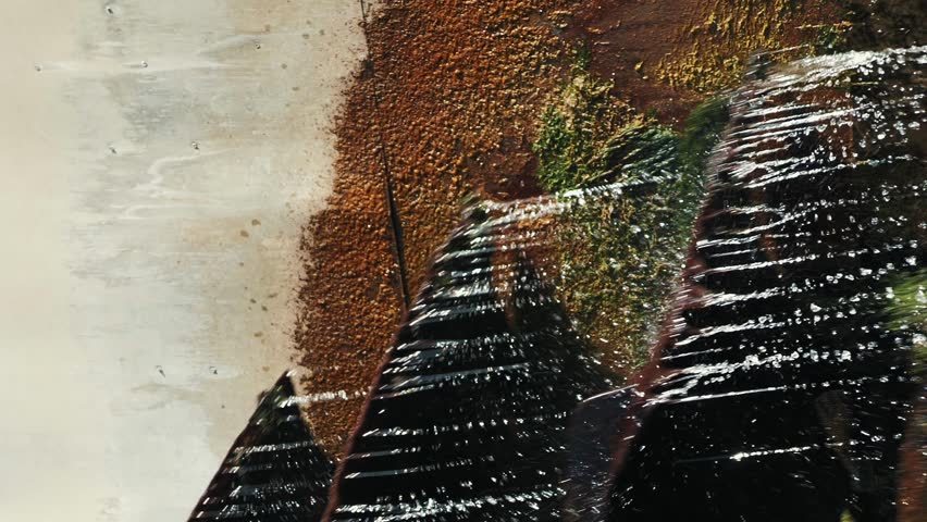 Old water mill wheel rotating. Vertical video. Close up of rotating water mills