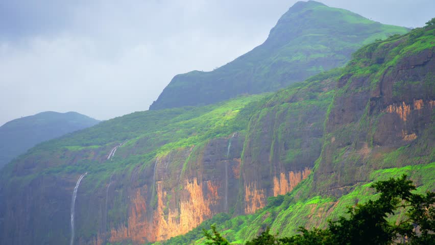 clouds moving on beautyful hills in a forest
