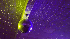 Disco ball restoran party.Neon Disco ball for music broadcast TV, night clubs, music videos, LED screens and projectors, glamour and fashion events, jazz, pops, funky and disco party. Colorful lights
