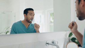 Dental, bathroom mirror and man brushing teeth with toothbrush, toothpaste and home morning treatment. Reflection, enamel care routine and person cleaning mouth for oral shine, hygiene or wellness - Powered by Shutterstock - Get 15% off with code: PIKWIZARD15