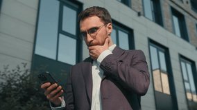 Confident male businessman Caucasian man employer real estate agent business developer in city near office outdoors take mobile phone from jacket pocket reject incoming call unpleasant spam message - Powered by Shutterstock - Get 15% off with code: PIKWIZARD15