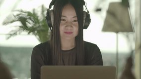 Happy Female Person Watching Music Video With Headphones