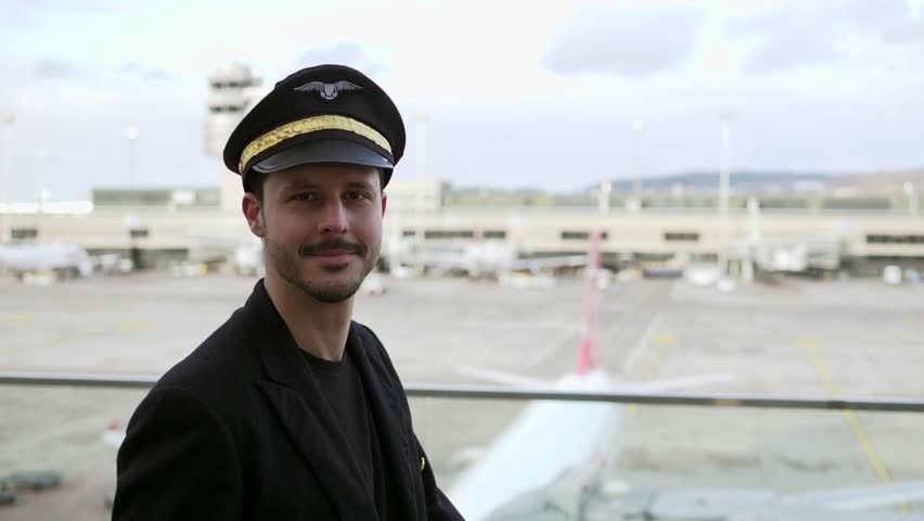 Portrait of Proffesional Male Pilot Captain Working in Aviation Business