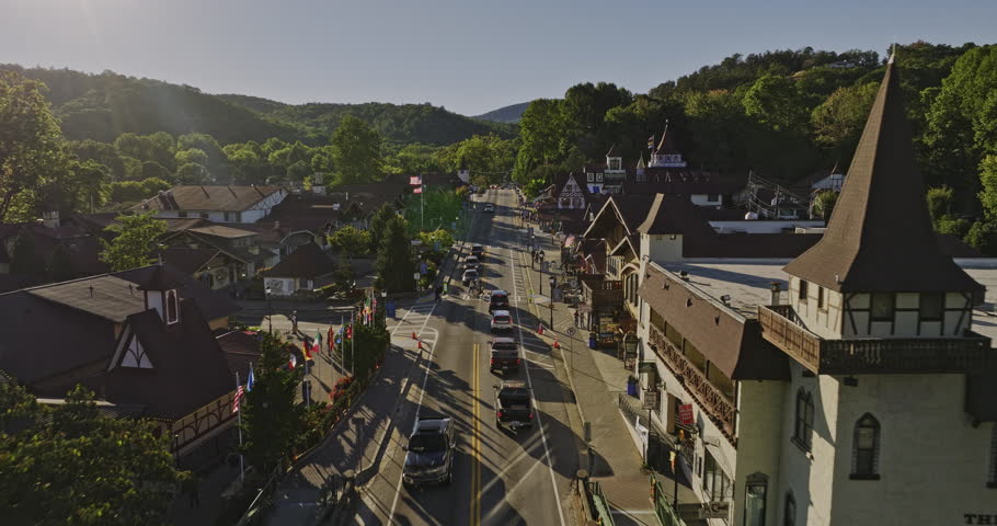 Helen Georgia Aerial v10 low flyover touristic mountain town along the main street capturing traditional Bavarian-style architectures on a beautiful sunny day - Shot with Mavic 3 Cine - October 2022