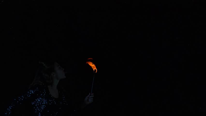 Woman fire breather blowing a fireball in slow motion. Royalty-Free Stock Footage #1108575205