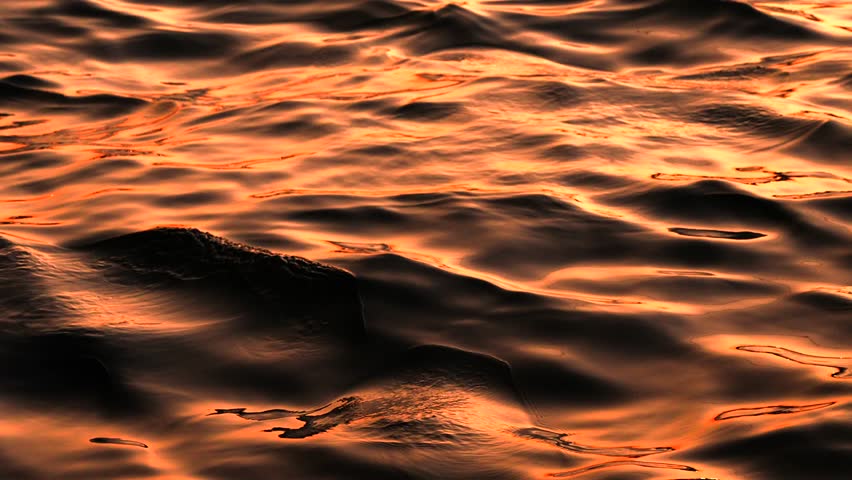 Slow motion close-up of the golden sun reflection on the water surface. Sea meditation calm background Royalty-Free Stock Footage #1108585535