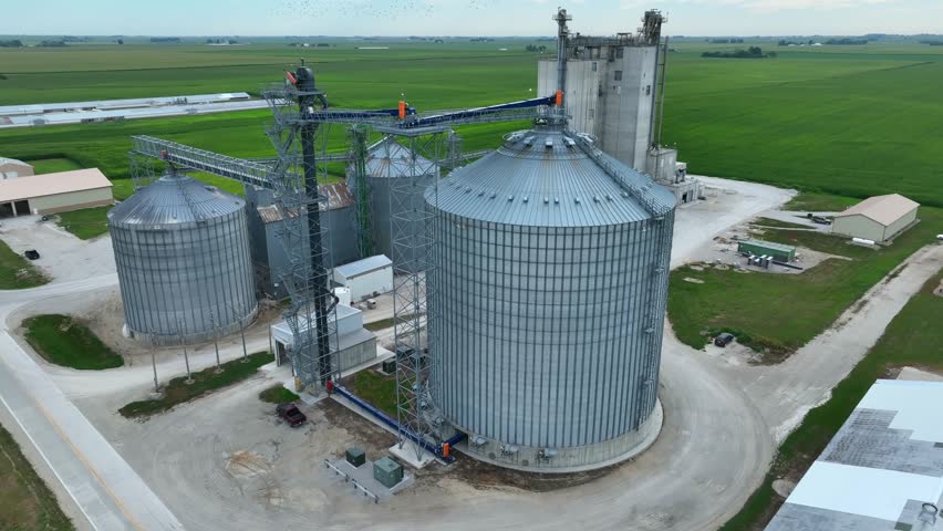 Grain elevator and ethanol plant in Midwest USA. Aerial orbit in summer. Royalty-Free Stock Footage #1108589429