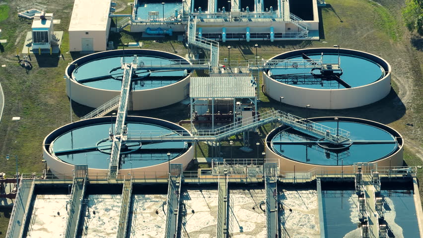 Modern water cleaning facility at urban wastewater treatment plant. Purification process of removing undesirable chemicals, suspended solids and gases from contaminated liquid Royalty-Free Stock Footage #1108598903