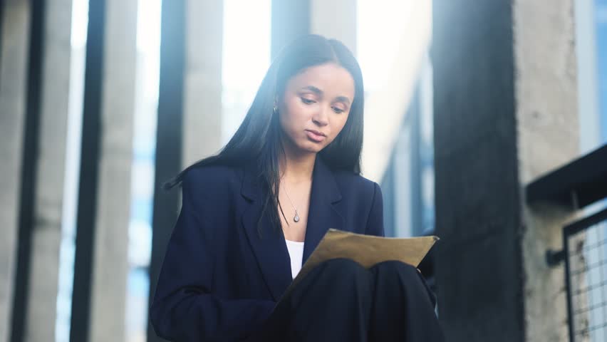 Worried young businesswoman checking mail open envelope and reading bad negative news work result rejection letter feeling disappointed at business centre Defeat Loss Disappointment concept Royalty-Free Stock Footage #1108599511