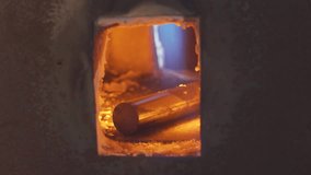 Blacksmith heating a hot metal rod, 4k footage