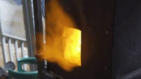 Blacksmith burning a hot furnace before heat the rod, 4k footage