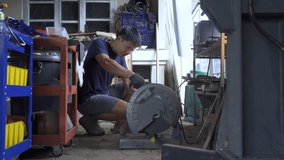 Blacksmith cutting a hot metal rod, 4k footage