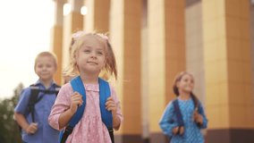 back to school. group of children with backpacks goes to school. school education learning concept. children with briefcases and backpacks go to school for lessons outdoors lifestyle - Powered by Shutterstock - Get 15% off with code: PIKWIZARD15