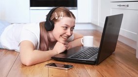 Close-up of a teenage girl who communicates online using a laptop