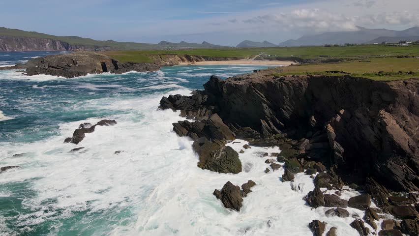 Aerial 4K drone footage of Dingle peninsula in Ireland, Summer time, full of rocks cliffs, ocean waves and birds Royalty-Free Stock Footage #1108611461