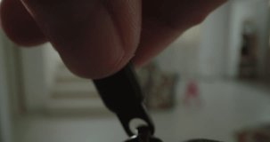 Extreme macro video of a zipper closing a garment. A man's hand closes a bag. High quality 4k footage