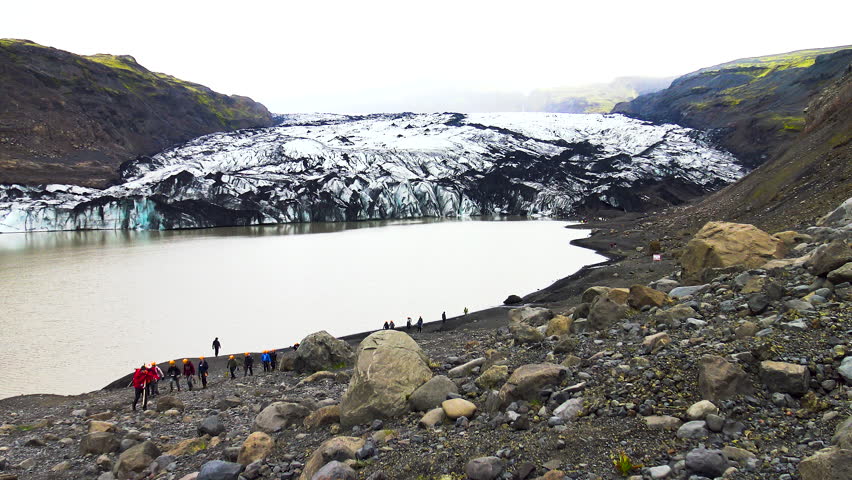 People hiking with crampons on the Skaftafell glacier in southeast Iceland.