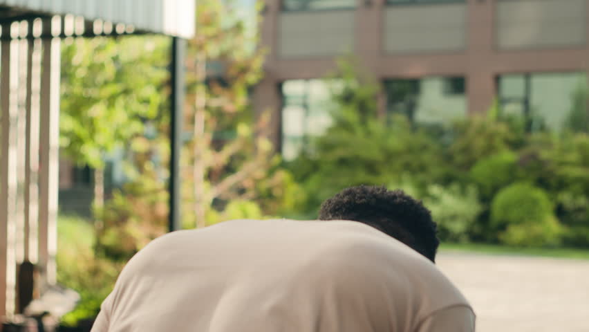 Back view African American mad angry worried anxious stressed man guy student male businessman in city outdoors suffer hysteria studying business problems stress nervous gesture love breakdown loss | Shutterstock HD Video #1108616945