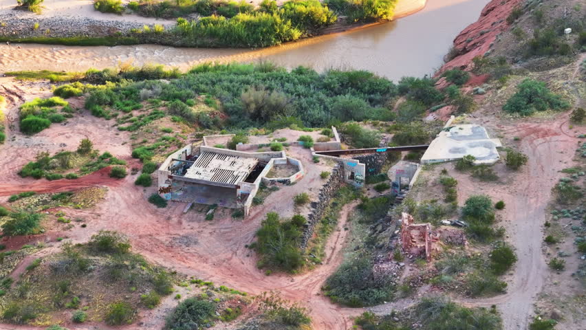 Aerial Virgin River gorge St George Utah abandoned ruins.  Southwestern desert Utah near St George. Red stone mountain landscape. Wilderness area. Geological landscape wind, weather and water erosion.