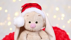 Toy bunny on a background with Christmas lights. - Powered by Shutterstock - Get 15% off with code: PIKWIZARD15