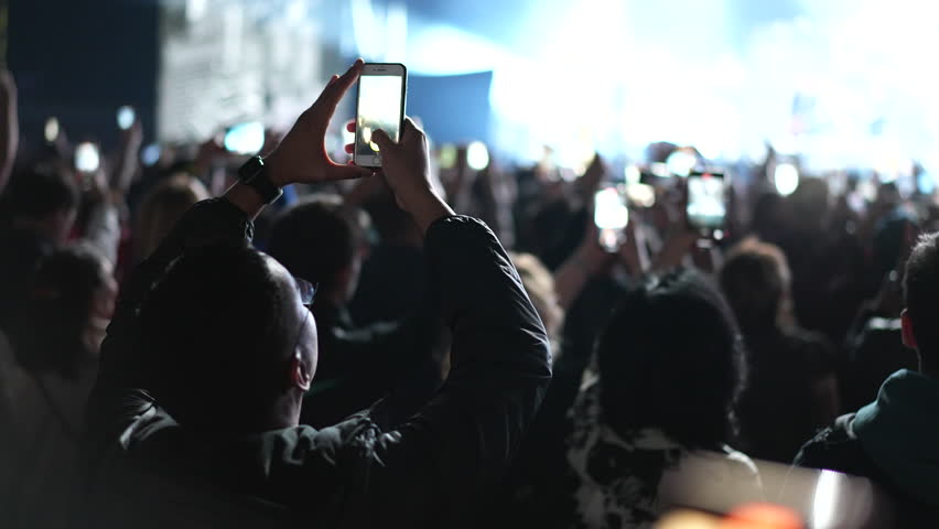 Lot fun people record music video use mobile phone. Fan crowd shoot k pop live concert. Many men hang out cool rave fest. Joy group chill night club hall. Dj star raise hand up. Make light glow photo. Royalty-Free Stock Footage #1108637627