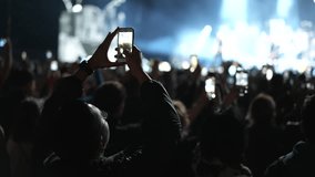 Lot fun people record music video use mobile phone. Fan crowd shoot k pop live concert. Many men hang out cool rave fest. Joy group chill night club hall. Dj star raise hand up. Make light glow photo. - Powered by Shutterstock - Get 15% off with code: PIKWIZARD15