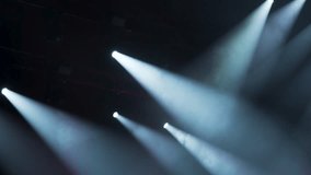 Many spotlights illuminate concert stage. Colorful spot light effect. Cool theater lighting show. Bright spotlight projector shines scene. Atmosphere nightclub party. Epic disco background. Shiny beam - Powered by Shutterstock - Get 15% off with code: PIKWIZARD15